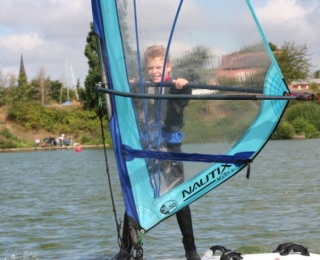 Young windsufer having a blast